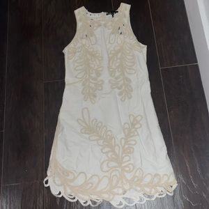 White Maje dress with cream pattern.